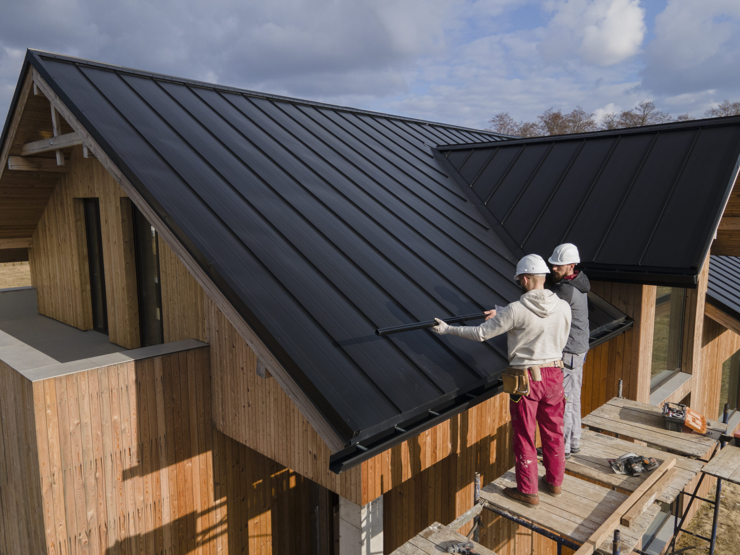 Roofing Workers installing new roof.